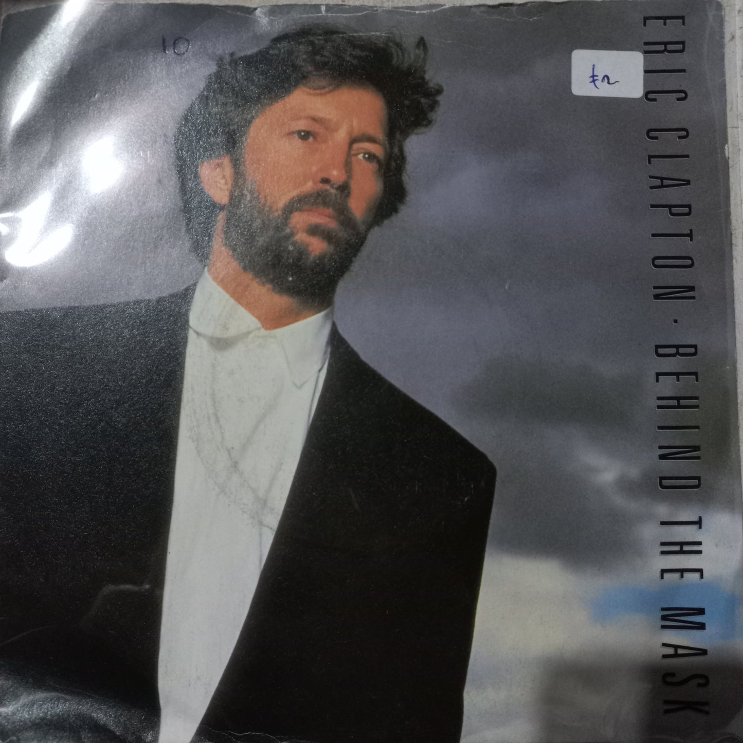 Eric Clapton Behind The Mask Simple 7" 2da. Mano VG+